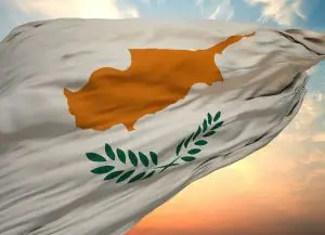 Closeup view of the flag of the Cyprus on a background of sunset