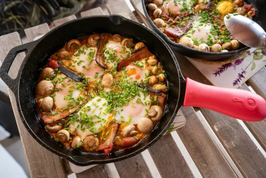 Cypriot skillet baked eggs, Cyprus dish with bacon mushrooms and eggs