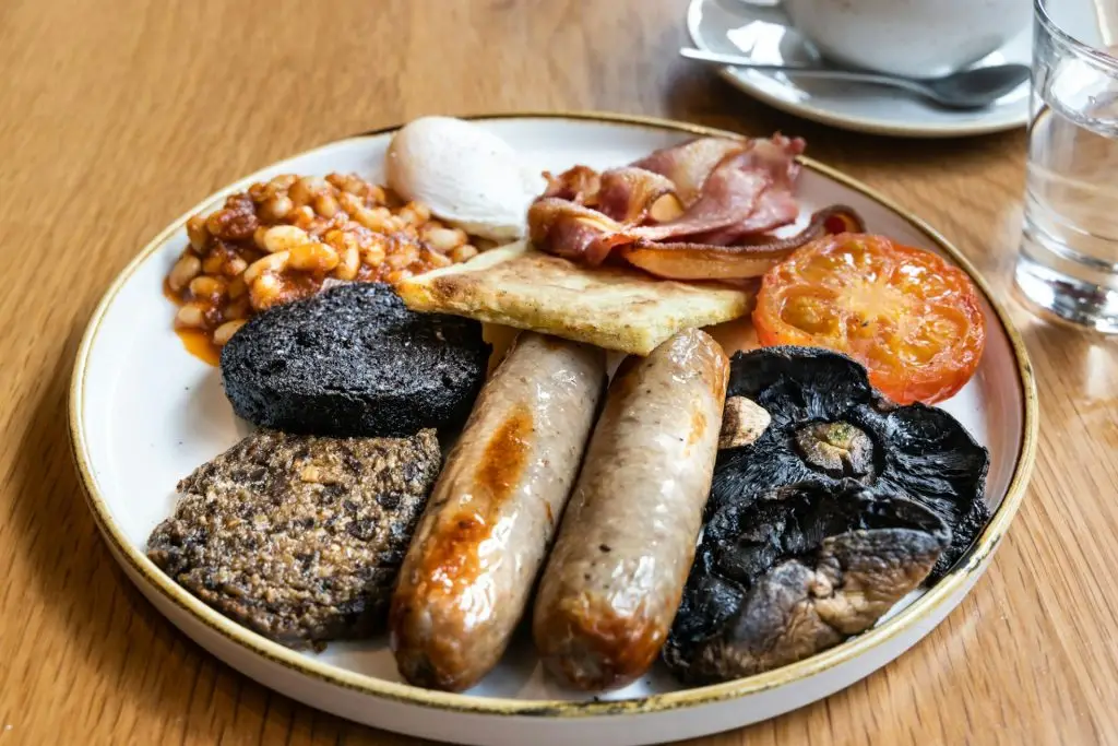 Traditional Scottish breakfast with haggis, ham, sausages, mushroom, baked beans