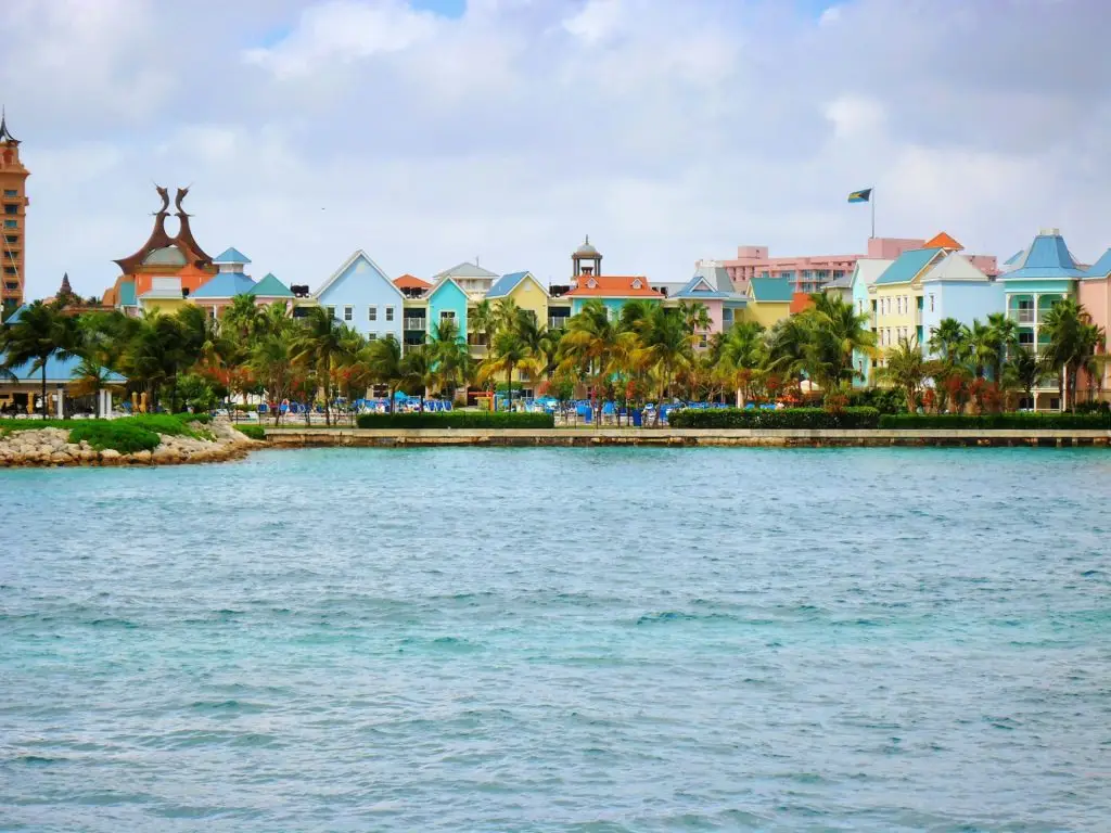 Colorful row of buildings houses on tropical island in Bahamas - vibrant travel, pastel paradise