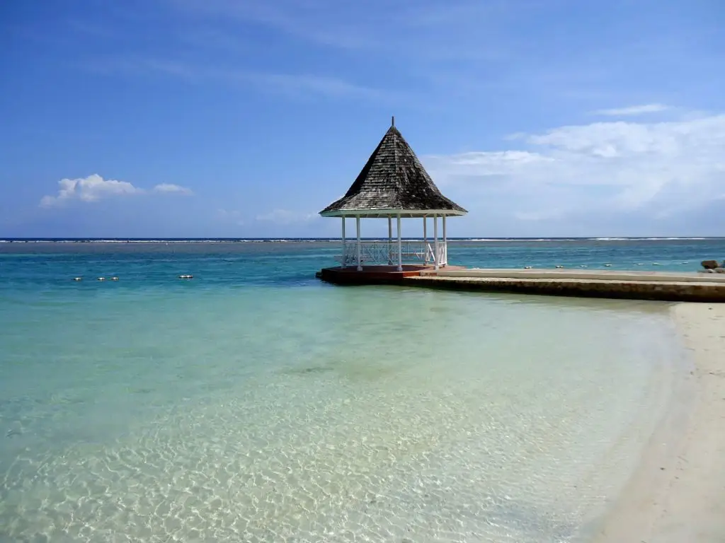 Tropical Island beach pier with a gazebo in the Caribbean Sea, Jamaica