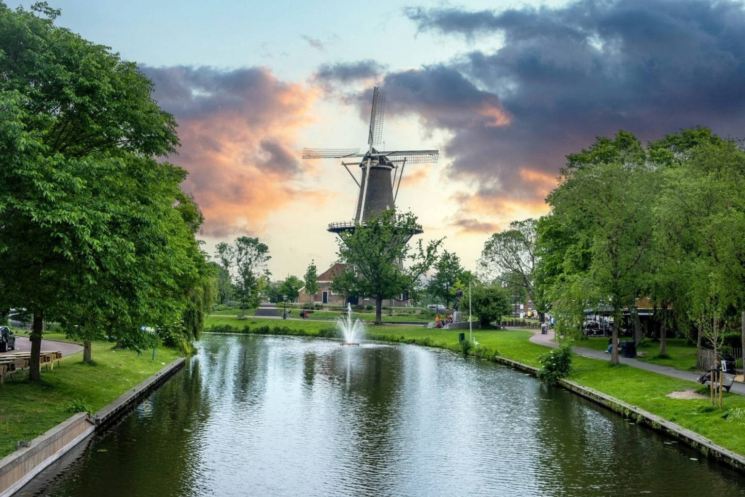 Windmill De Valk at sunset, tower mill and museum in Leiden city, Holland Netherlands.