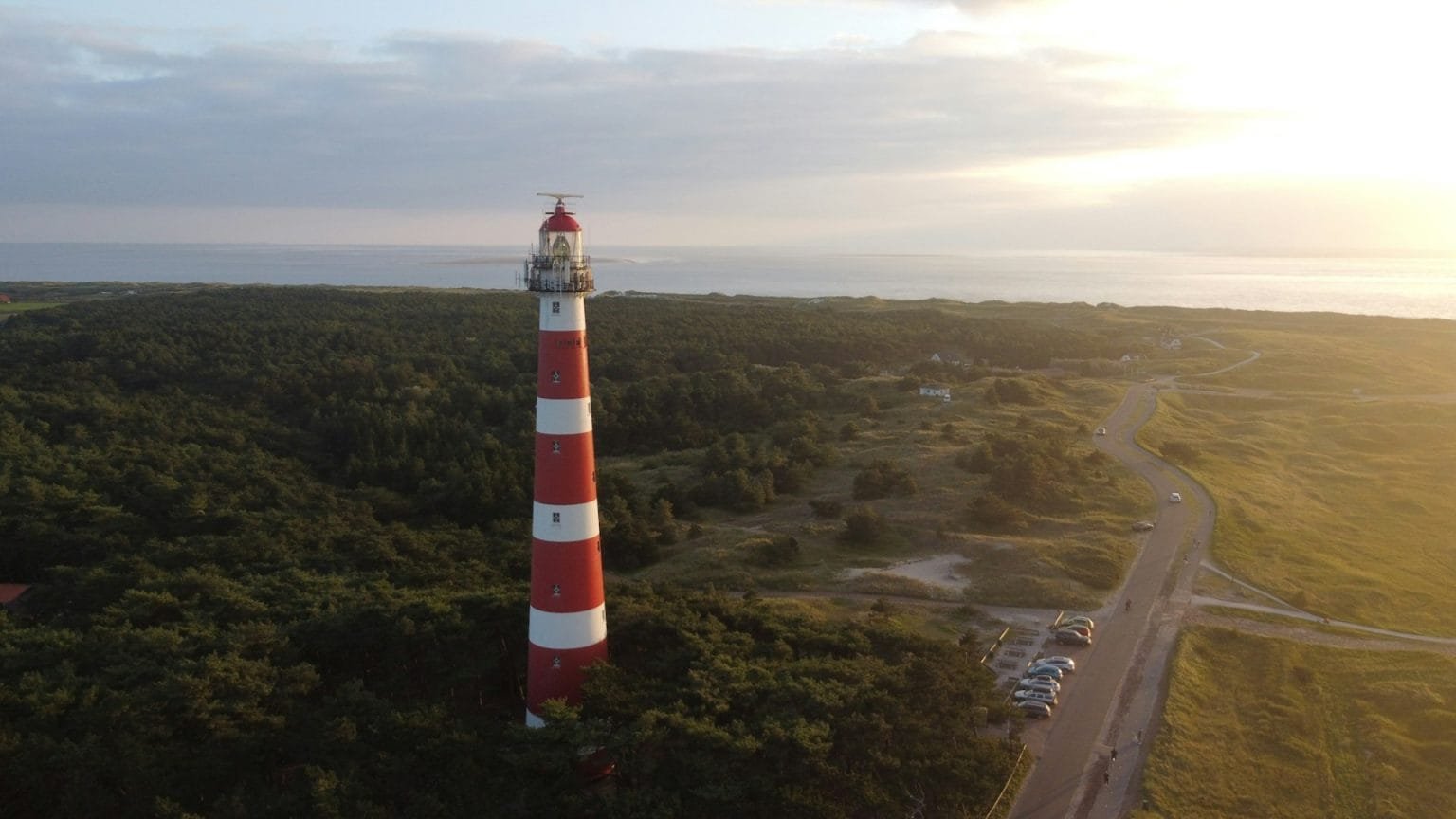 Aerial view of the Bornrif Lighthouse in the countryside of Ameland, the Netherlands at sunset