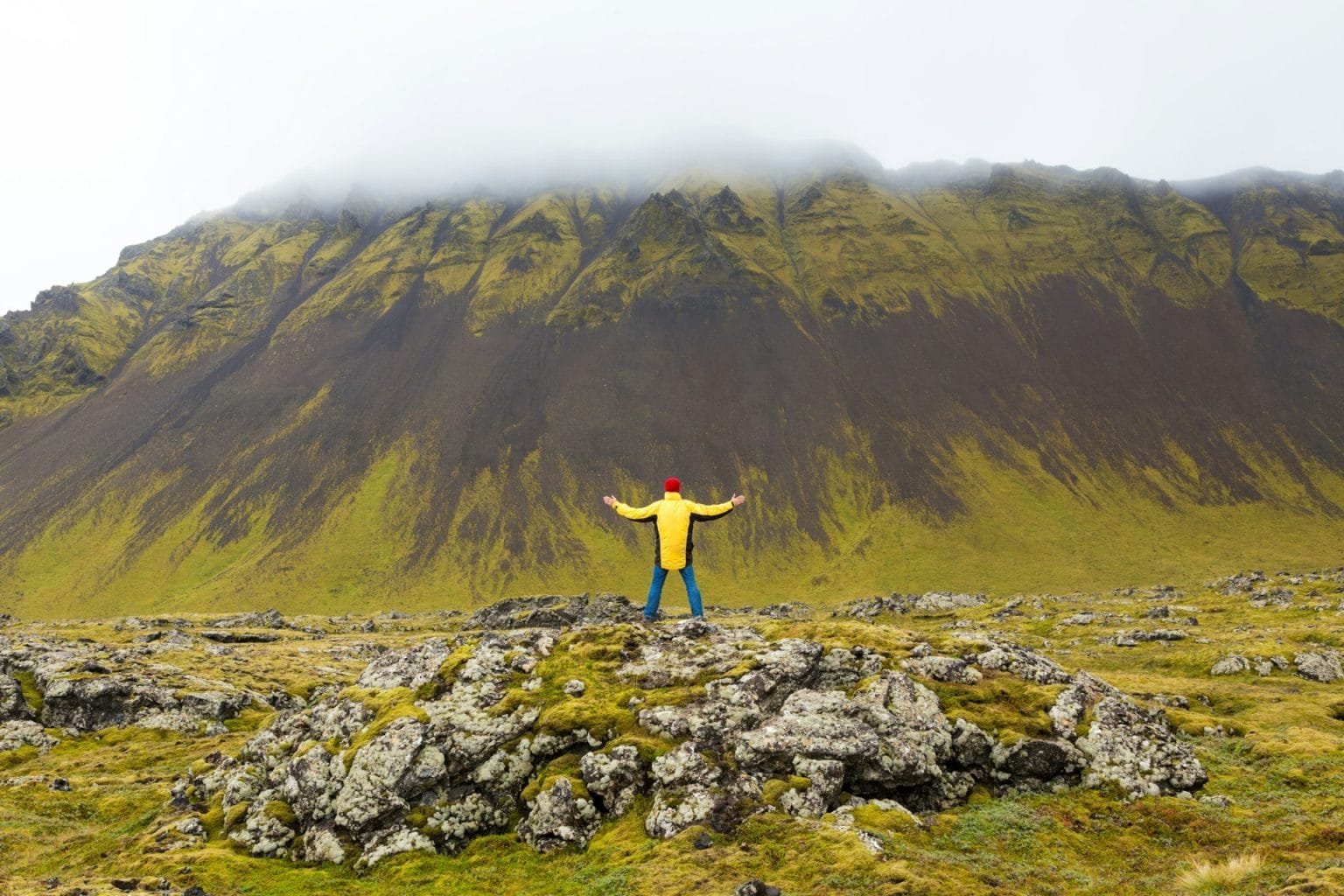 Man standing on rocks, Snæfellsnes peninsula, West Iceland