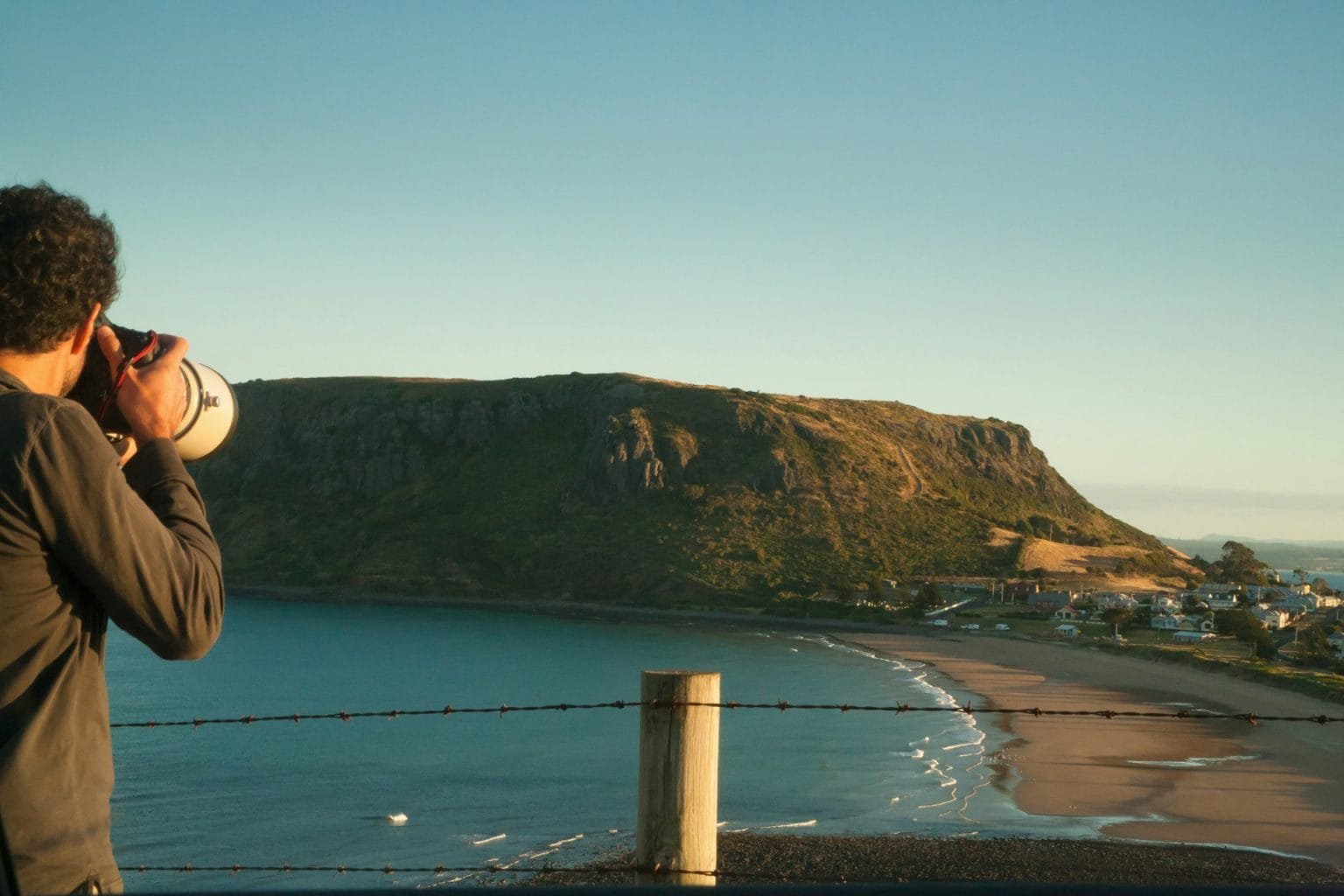 Photographer taking photographs of view, Tasmania