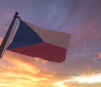 Czech Republic Flag on Flagpole by Evening Sunset Sky