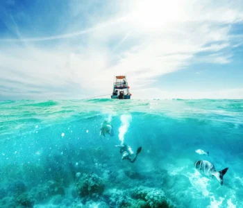 Divers and Boat in the Caribbean Sea
