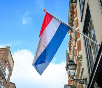 Flag in Amsterdam sky at netherlands street