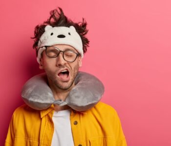 Tired or sick male passenger yawns as wants to sleep, has sleepy expression, suffers from insomnia d