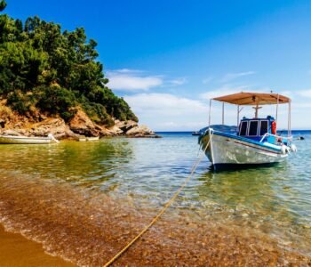 Traditional colorful boats in old town of Skiathos island, Sporades, Greece.